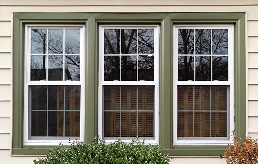 A quiet, energy-efficient home interior showcases large triple-pane windows that enhance both comfort and performance.