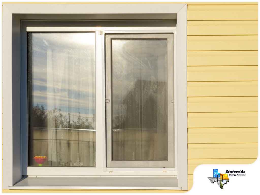 A well-lit room features large argon-filled windows, designed to boost energy efficiency without sacrificing style. 